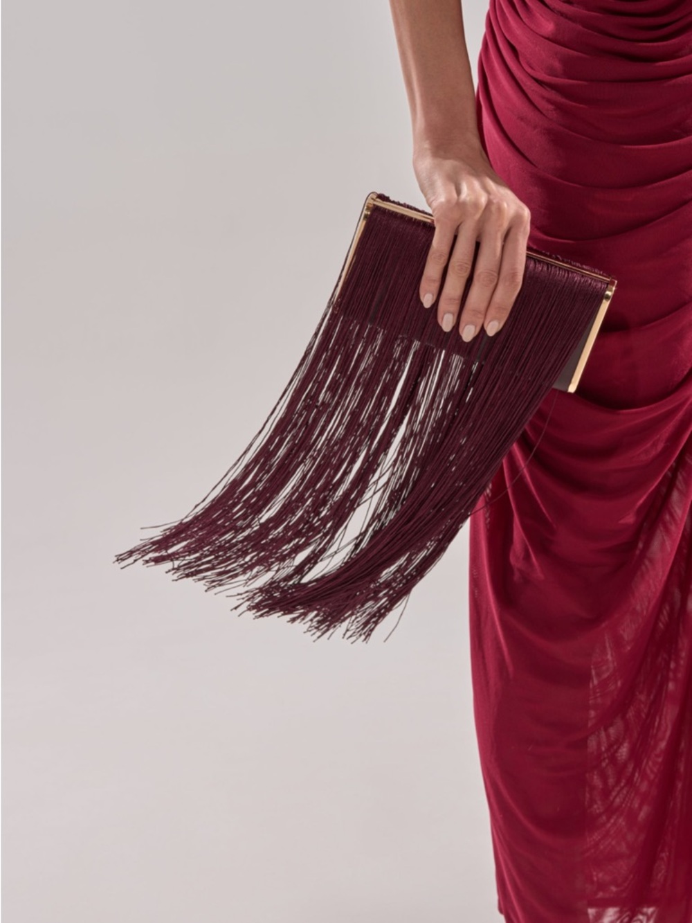 AKIRA Burgundy Fringe Clutch with Gold Accents